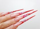 Red stiletto nails with one stroke. Sculpted on double nail form from Nail Perfect